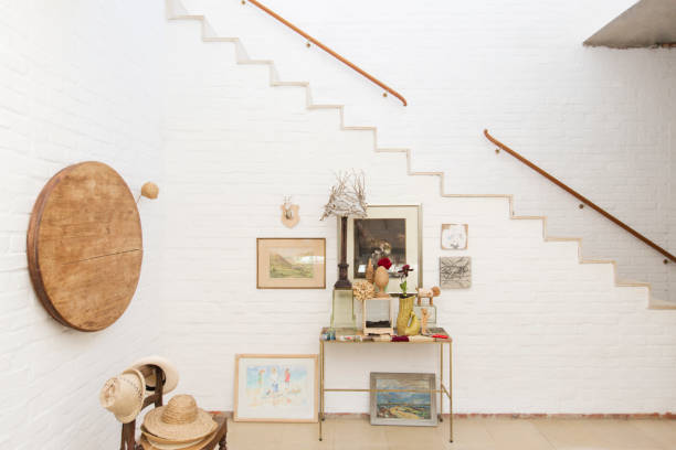 istock Side table and wall hangings by staircase 507832217