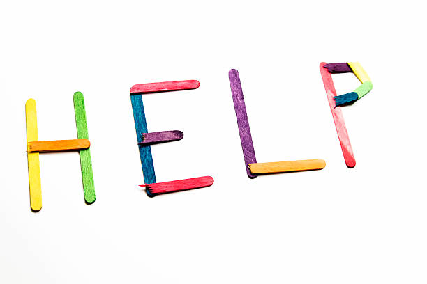 istock Word Help Spelled Out With Colored Popsicle Sticks 507832288