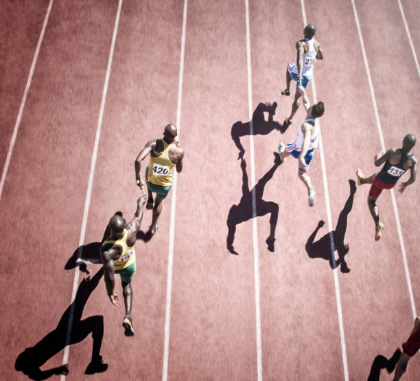 Relay race handing over from woman to man