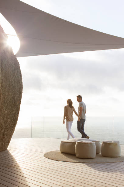 istock Couple walking on modern balcony 507833403