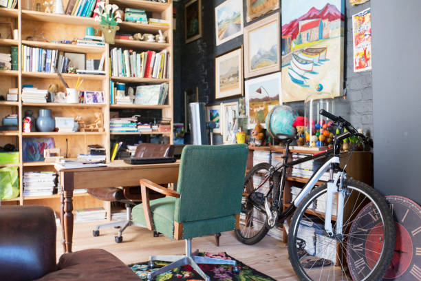 istock Desk, bookshelves and bicycle in study 507833407