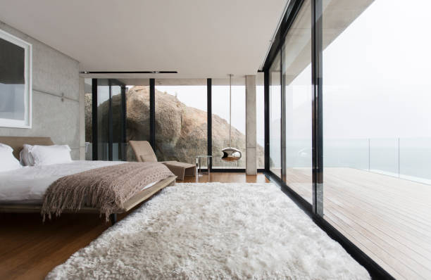 Shag rug and glass walls in modern bedroom  shag rug stock pictures, royalty-free photos & images