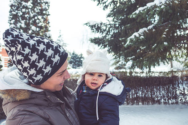 istock Mother and baby outdoors on cold winter day 507833636