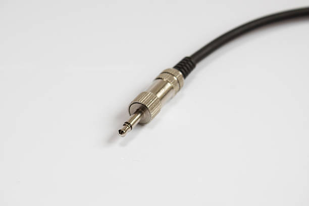 istock black audio cable ,chrome  jack plug isolated on white backgroun 507833644