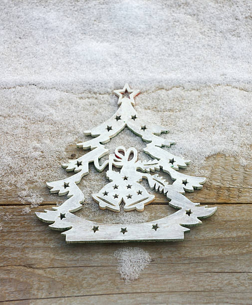 istock Christmas tree ornament in a snow background 507834040
