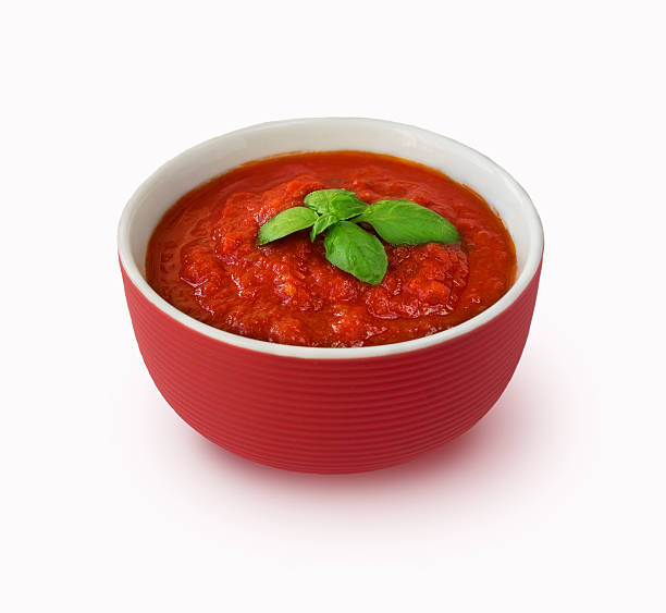 istock Tomato sauce with basil isolated on white background 507834184
