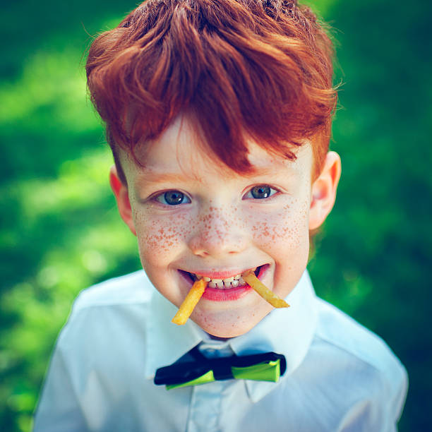 Redhead boy outdoors