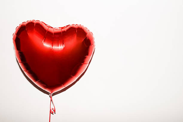 Heart Shape Balloon Red heart shaped helium balloon helium balloon stock pictures, royalty-free photos & images