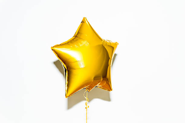 Star Shape Balloon Golden star shaped helium balloon helium balloon stock pictures, royalty-free photos & images