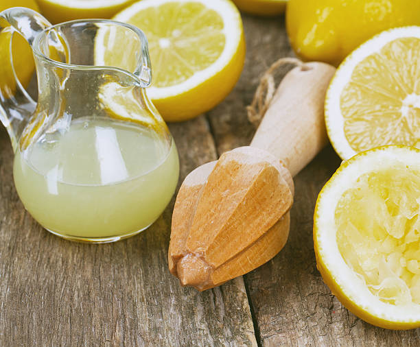 istock lemon juicer on an old wooden table 507839030