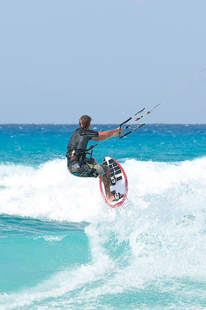kitesurfing on the waves of the Mediterranean kitesurfing on the waves of the Mediterranean in Egypt sand river stock pictures, royalty-free photos & images