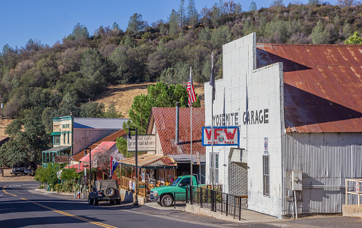 Coulterville, CA, USA - October 9, 2015: Main street in Coulterville with cars, shops, a garage and hotel Jeffery