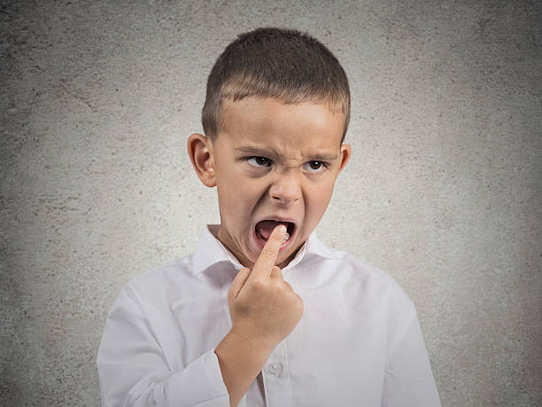 istock Unhappy Boy sticking finger in his mouth 507839964