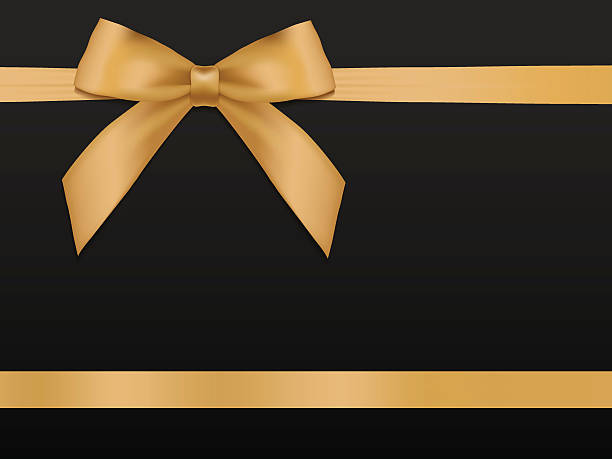 istock Gold Bow with ribbons. Shiny holiday gold satin ribbon background 507840424