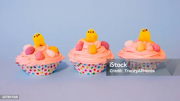 Three Easter Cupcakes With Yellow Chicks And Easter Eggs Stock Photo - Download Image Now