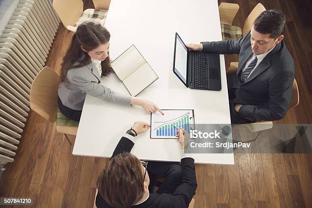 Analyzing Financial Stats Stock Photo - Download Image Now - Improvement, Efficiency, Sale