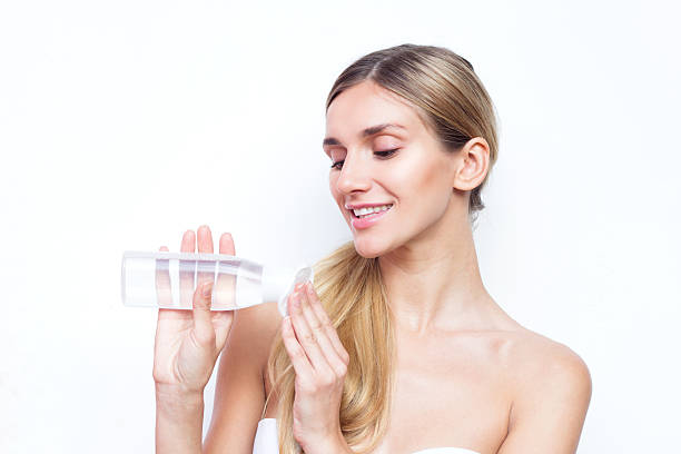 istock Smiling woman with makeup remover and cotton pad 507841996