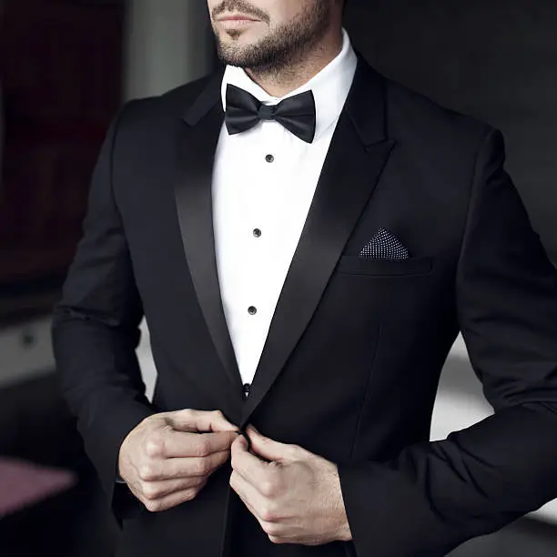Photo of Man in tuxedo and bow tie