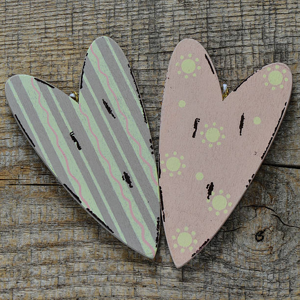 istock decorative hearts on wooden background 507842332