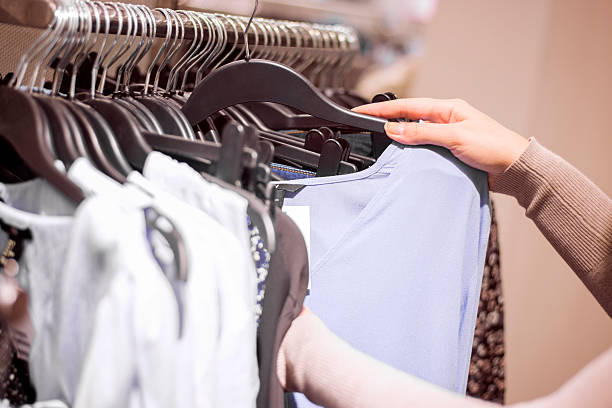 istock Woman selecting clothes in shop 507843346