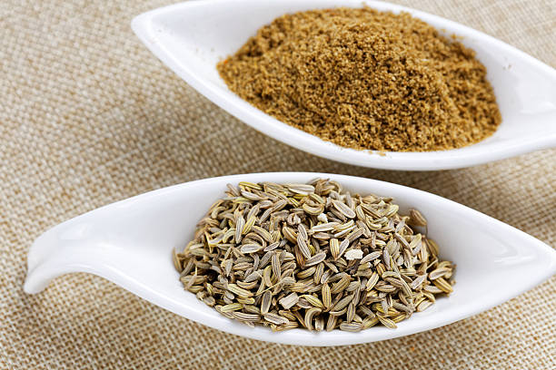 istock Fennel powder and seeds on texture background 507846258