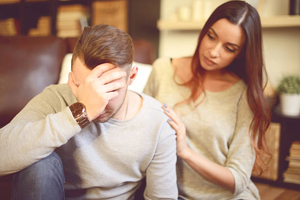 Consoling her depressed Boyfriend Consoling her depressed Boyfriend man crying stock pictures, royalty-free photos & images