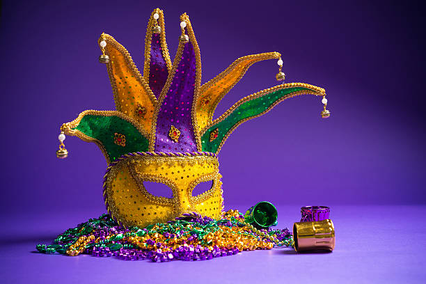 Assorted Mardi Gras or Carnivale mask on a purple background stock photo