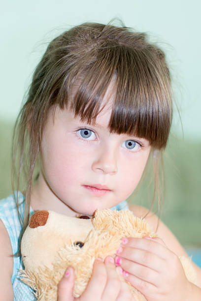 istock girl with a soft toy 507847724