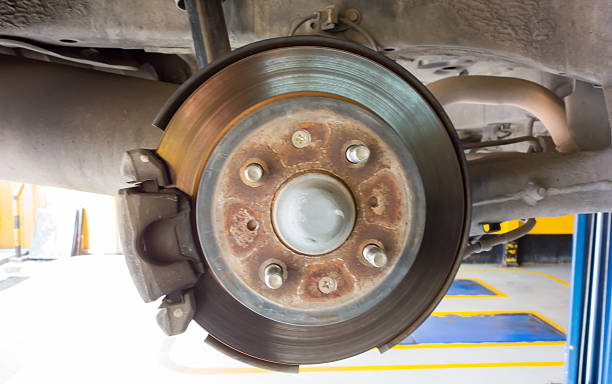 istock Rear disc brake car in process of new tire replacement 507849512
