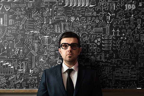 istock Businessman Idea Concept on blackboard 507849908