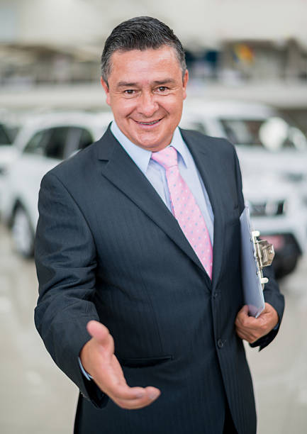 istock Car salesman handshaking 507854651