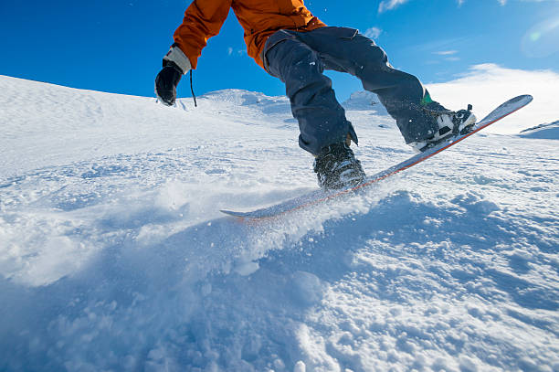 istock Snowboarder turning on a blue sky day 507855423