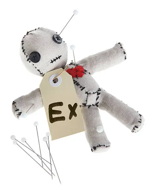 Cute handmade voodoo doll (Made completely by me) with a tag marked "Ex", being stabbed by pins