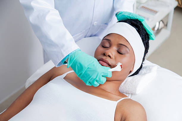 istock African patient getting micro-needling treatment by her doctor 507856581