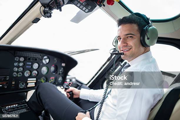 Pilot Flying A Helicopter Stock Photo - Download Image Now - Helicopter Pilot, Pilot, Cockpit