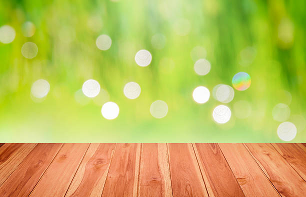 istock Wooden floor inside green Bokeh for background 507858273