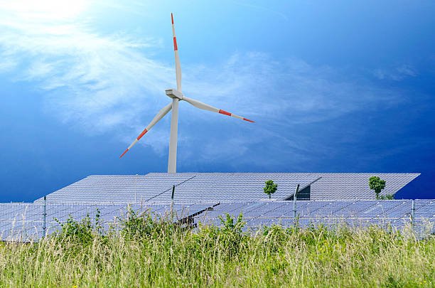 Wind turbin and solar panels stock photo