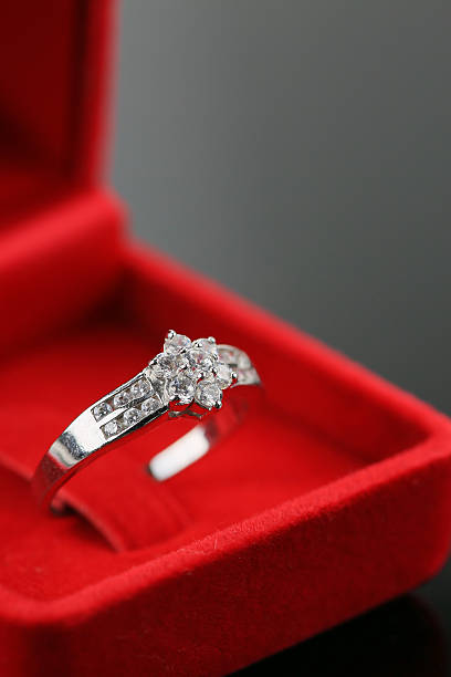 istock Wedding rings background, beautiful silver ring in red box 507864330