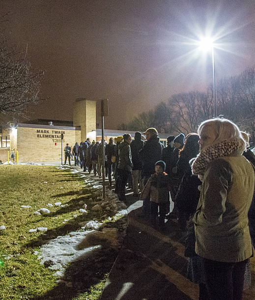 2016 Iowa Caucus In Iowa City Iowa City, United States- February 1, 2016: Heavy turnout for the 2016 Democratic Iowa Caucus in Precinct 14 at Mark Twain Elementary School in Iowa City, Iowa with relatively mild for a January Iowa night. hillary clinton stock pictures, royalty-free photos & images