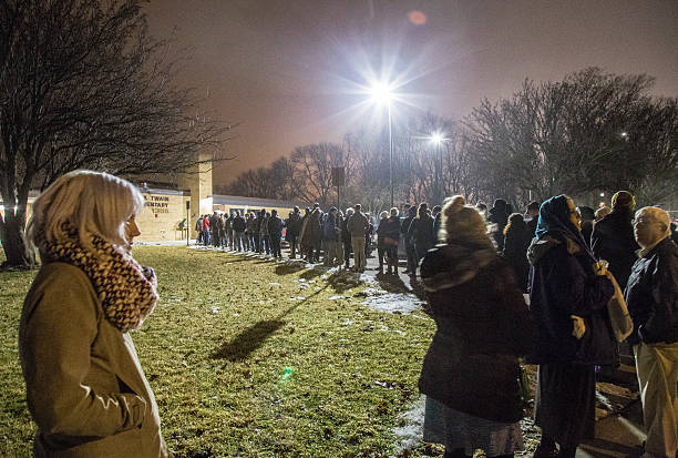 2016 Iowa Caucus In Iowa City Iowa City, United States- February 1, 2016: Heavy turnout for the 2016 Democratic Iowa Caucus in Precinct 14 at Mark Twain Elementary School in Iowa City, Iowa with relatively mild for a January Iowa night. hillary clinton stock pictures, royalty-free photos & images