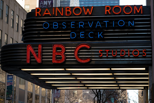 New York, USA - January 11, 2016: The famous neon NBC Studios sign in Manhattans Times Square late in the day.