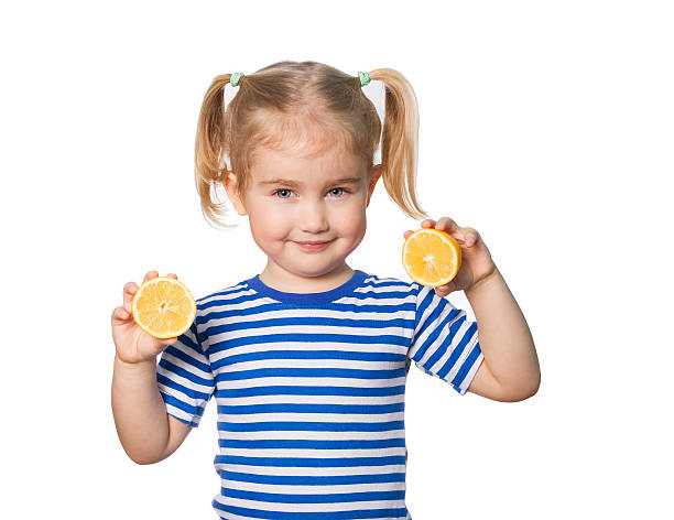 istock Little Funny girl keeps lemons 507869172