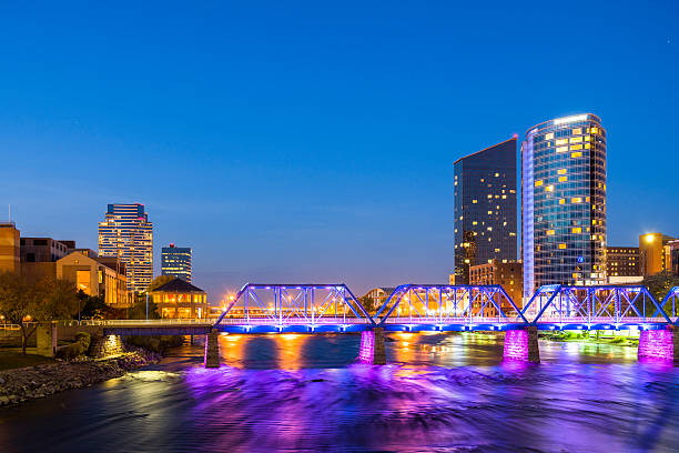 Grand Rapids downtown including river and bridge at dusk stock photo