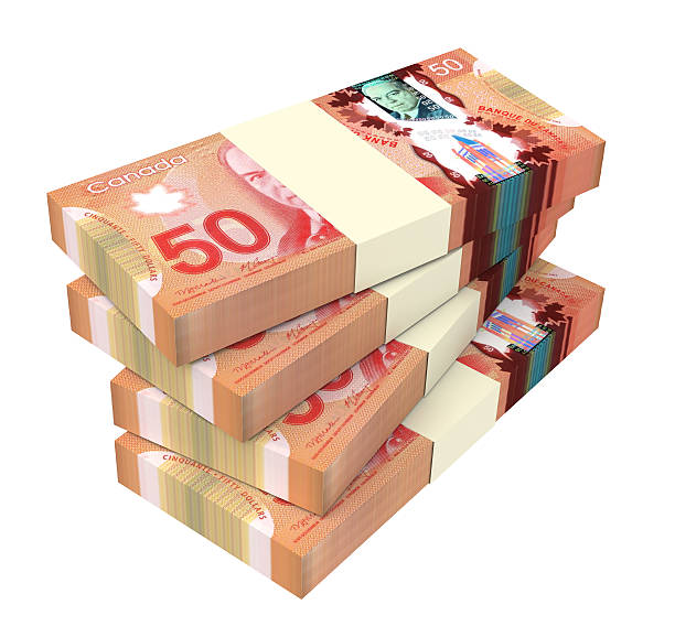 istock Canadian dollars bills isolated on white background. 507873148