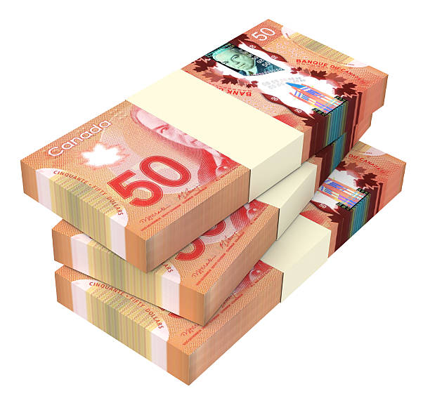 istock Canadian dollars bills isolated on white background. 507873280
