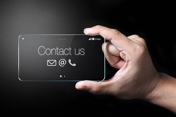 istock Contact us with smartphone and hand 507873990