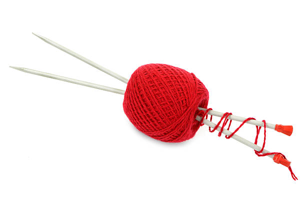 istock Red ball of yarn with knitting 507874128