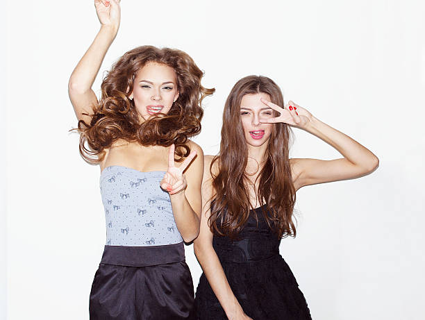 Two girl friends having fun stock photo