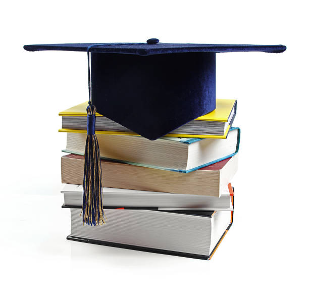 istock graduation hat and stack of books isolated on white 507876407