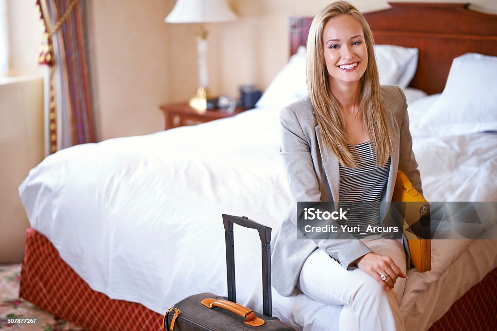 The only suite I check into when i travel Portrait of a beautiful businesswoman in her hotel room 20-29 Years Stock Photo